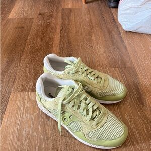 Green and white saucony shadow